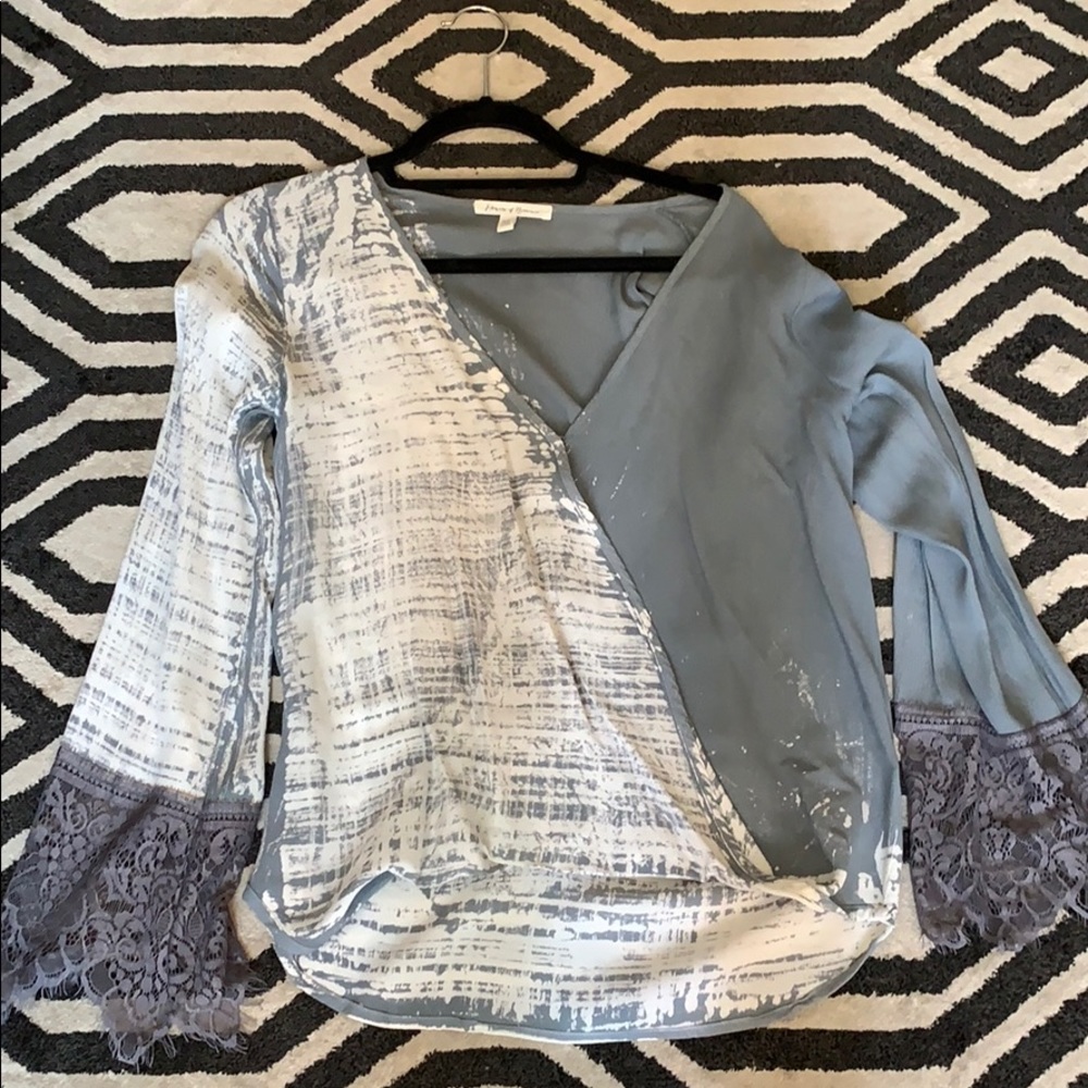 Blue and white silk blouse with lace sleeves
